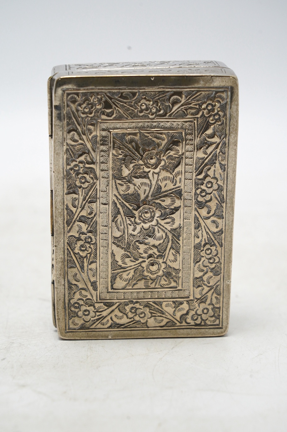 An early 20th century Chinese Export white metal card case by Wang Hing, 84mm, together with a Chinese white metal box with hinged cover. Condition - fair to good